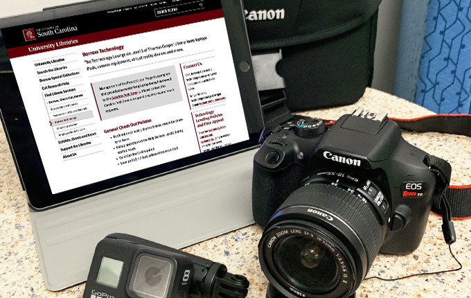 photograph of camera, iPad and GoPro camera